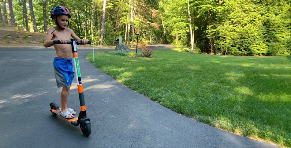 Child riding a electric scooter